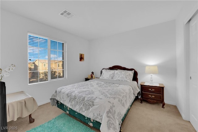 carpeted bedroom with a closet