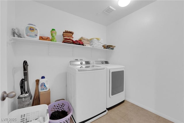 washroom with washer and clothes dryer