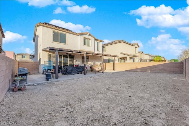 back of house with a patio area