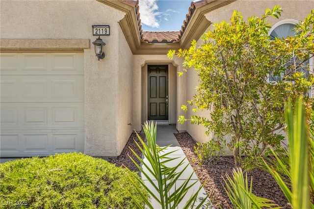 property entrance featuring a garage