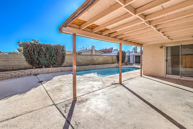 view of swimming pool with a patio