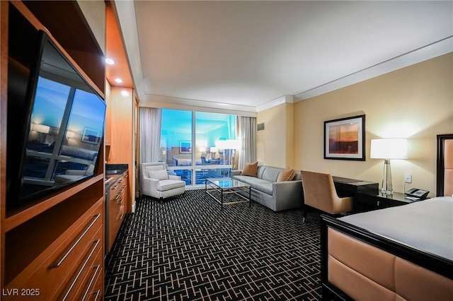 bedroom featuring expansive windows and carpet