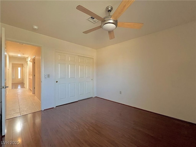 3012 Morning Ridge Dr, Las Vegas, NV 89134 - unfurnished bedroom with wood finished floors, a closet, and ceiling fan