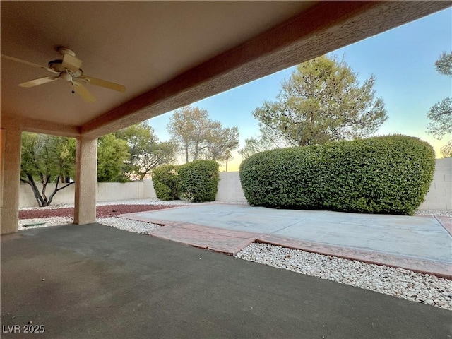 3012 Morning Ridge Dr, Las Vegas, NV 89134 - fenced backyard with ceiling fan and a patio area