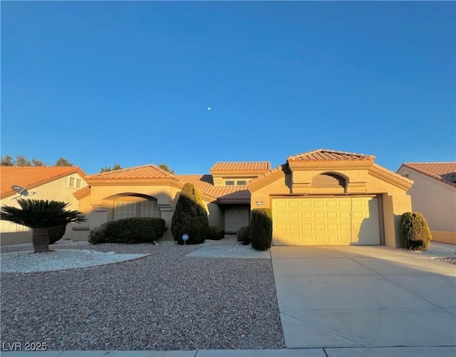 3012 Morning Ridge Dr, Las Vegas, NV 89134 - mediterranean / spanish house featuring stucco siding, an attached garage, concrete driveway, and a tiled roof