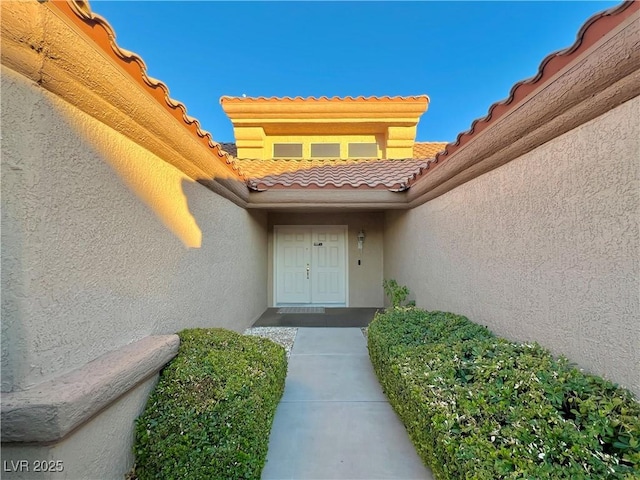 3012 Morning Ridge Dr, Las Vegas, NV 89134 - doorway to property featuring stucco siding and a tile roof