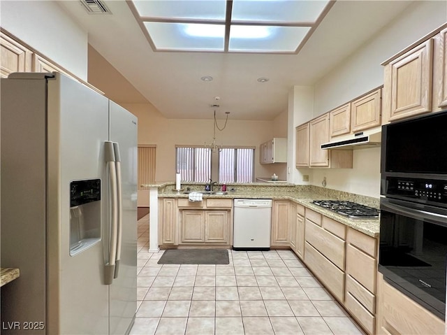 3012 Morning Ridge Dr, Las Vegas, NV 89134 - kitchen with white appliances, light brown cabinetry, a peninsula, under cabinet range hood, and light tile patterned floors