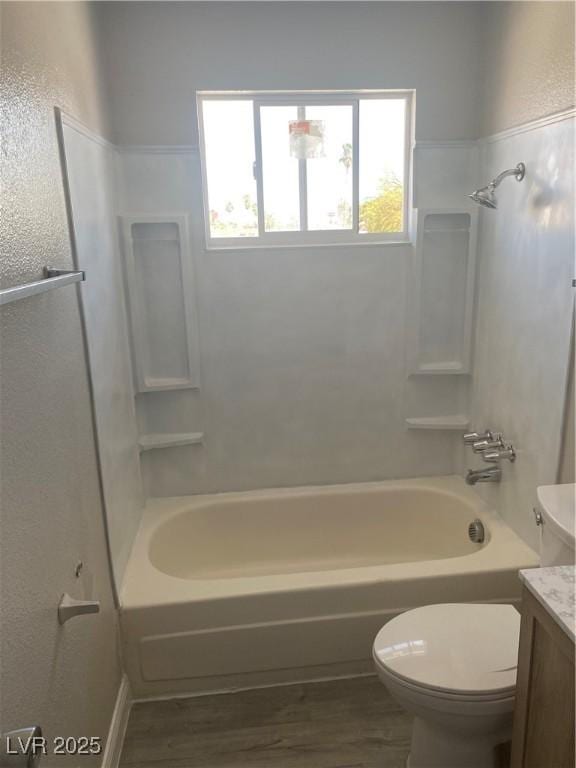 full bathroom with shower / tub combination, vanity, toilet, and wood-type flooring