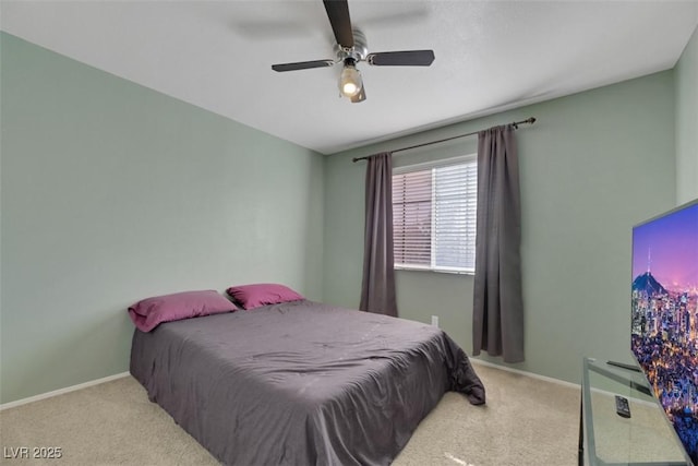 bedroom with light colored carpet and ceiling fan