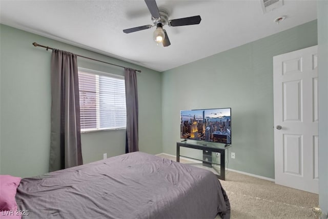 bedroom featuring ceiling fan and carpet