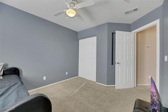 sitting room with carpet floors and ceiling fan