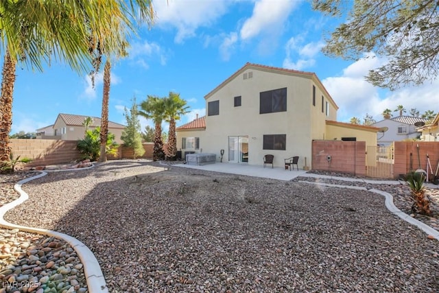 rear view of house with a patio