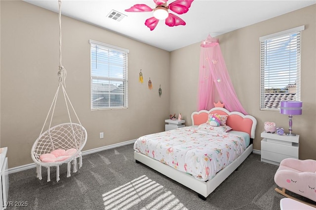 bedroom with dark carpet and ceiling fan