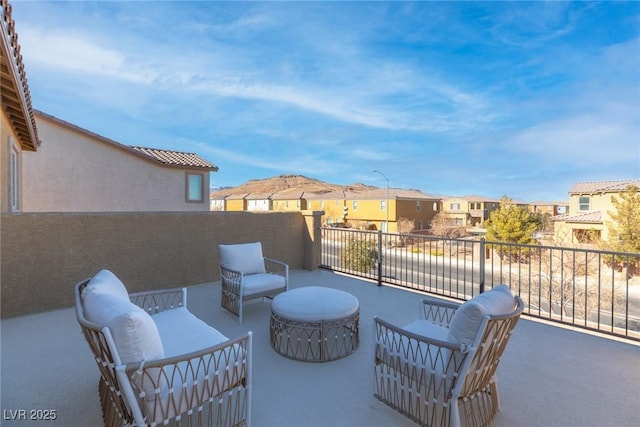 view of patio / terrace with a balcony