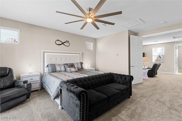 bedroom with ceiling fan and light carpet