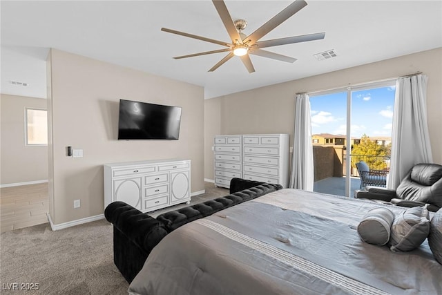 carpeted bedroom with ceiling fan and access to exterior