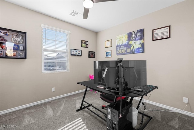 carpeted home office with ceiling fan