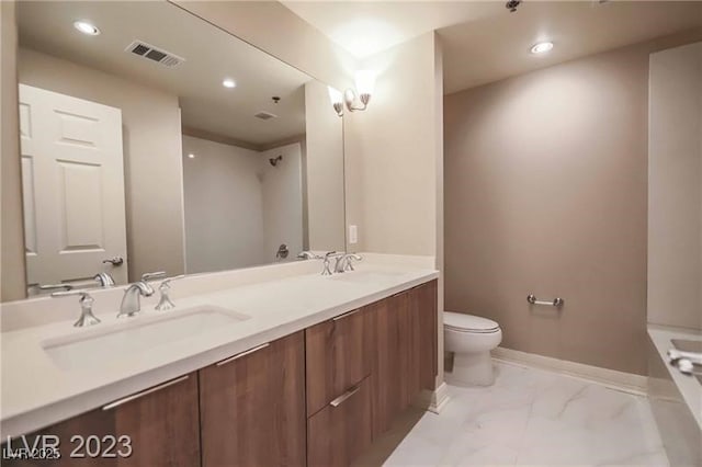 bathroom featuring vanity and toilet