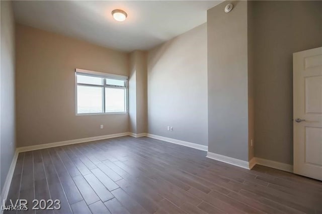 spare room featuring dark hardwood / wood-style floors