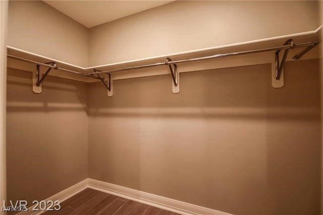 walk in closet featuring hardwood / wood-style floors