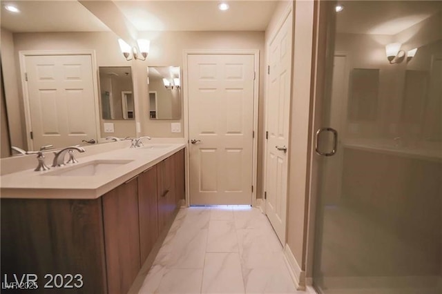 bathroom featuring vanity, an inviting chandelier, and walk in shower