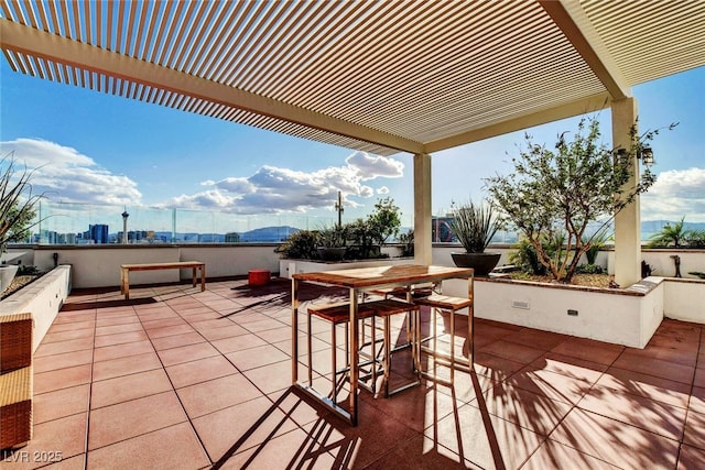 view of patio with a mountain view and a pergola