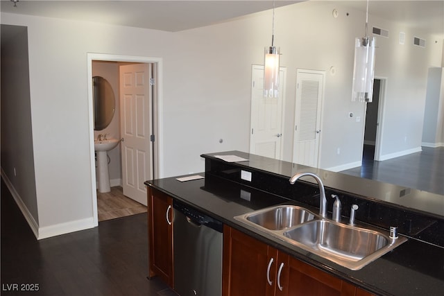 kitchen with pendant lighting, dishwasher, dark hardwood / wood-style flooring, and sink