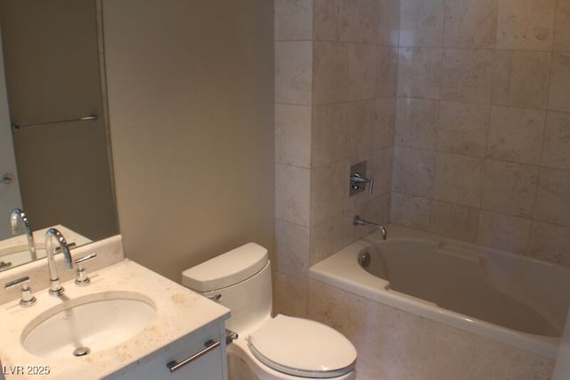 full bathroom featuring vanity, toilet, and tiled shower / bath combo