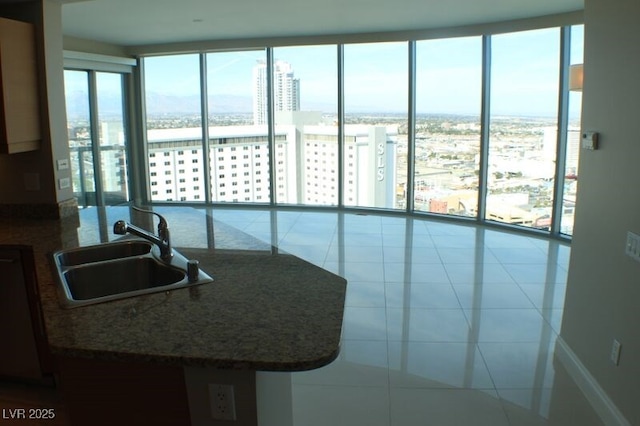 kitchen featuring tile patterned floors and sink