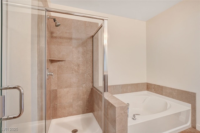 bathroom with shower with separate bathtub