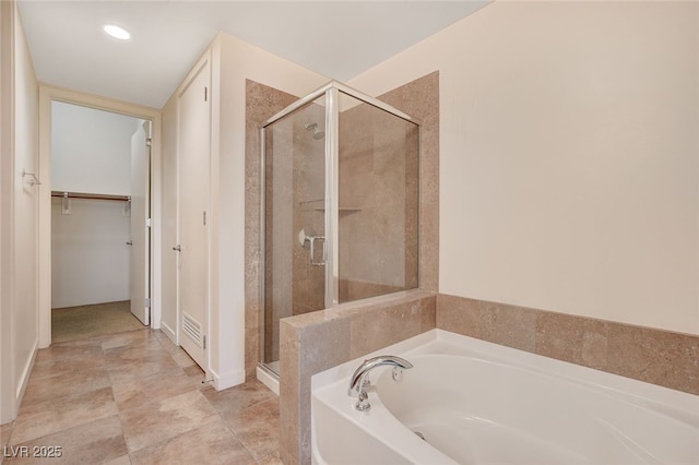 bathroom with shower with separate bathtub