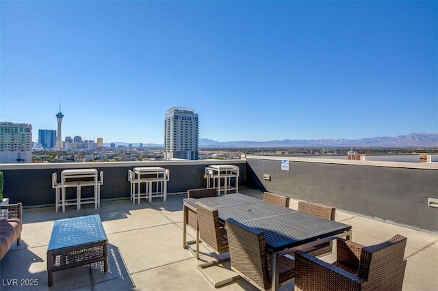 view of patio / terrace featuring a mountain view