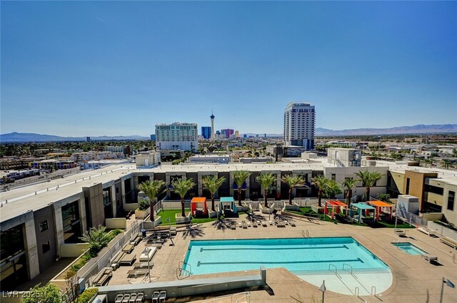 view of pool with a patio area and a mountain view