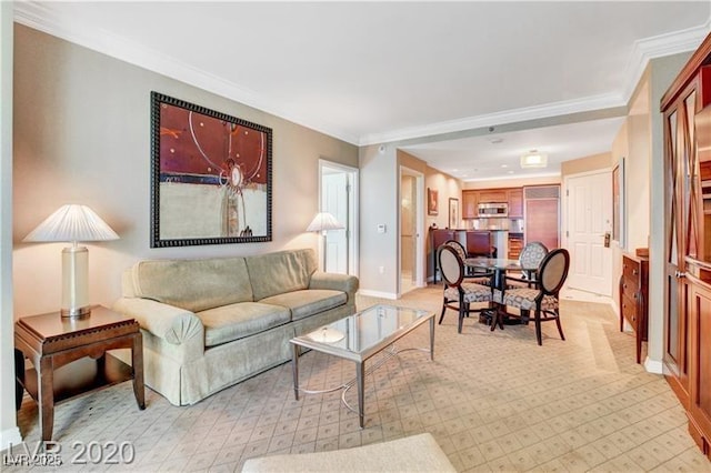 living room with ornamental molding