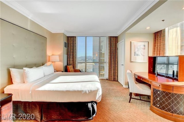 bedroom with crown molding