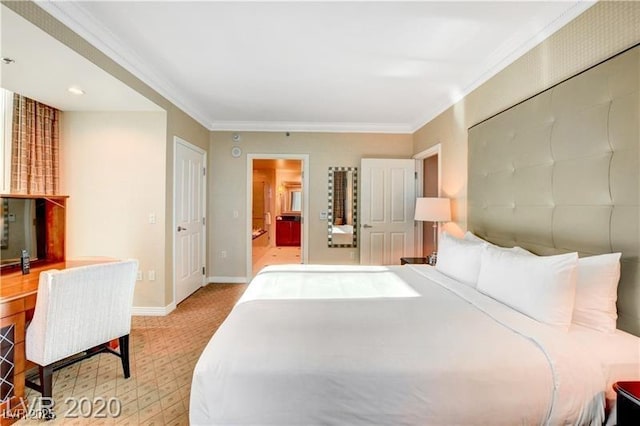 bedroom featuring ensuite bath, light colored carpet, and ornamental molding