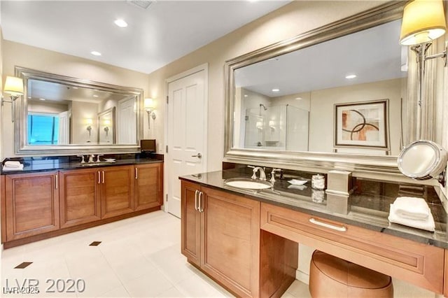 bathroom featuring vanity and walk in shower