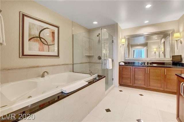 bathroom with separate shower and tub, tile patterned flooring, and vanity