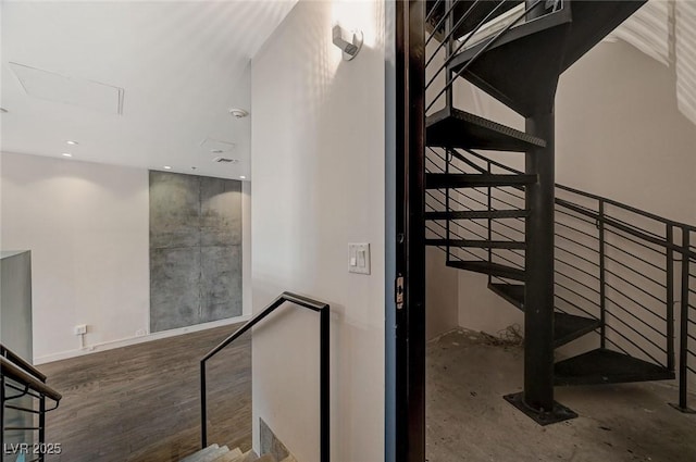 staircase with wood-type flooring