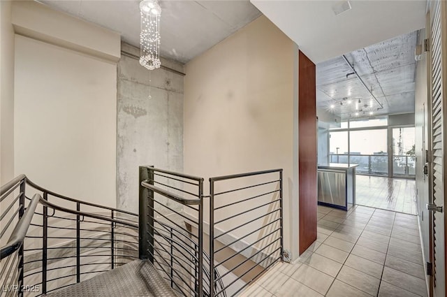 interior space with tile patterned flooring and a notable chandelier