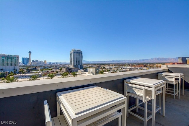 view of patio / terrace featuring a mountain view and a balcony