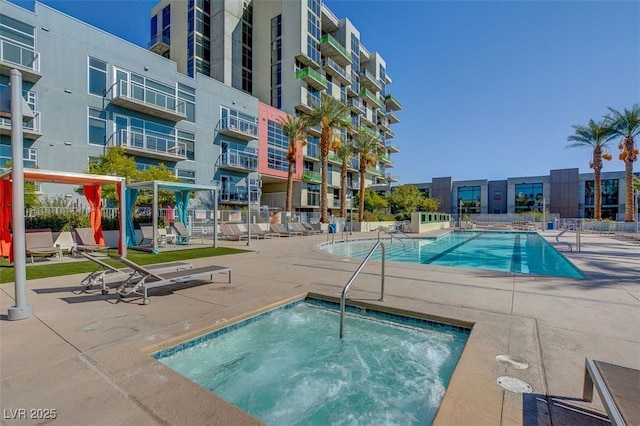 view of pool featuring a hot tub