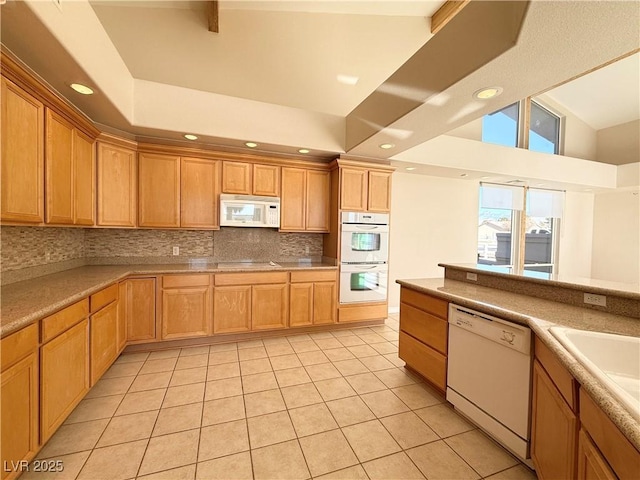 kitchen featuring decorative backsplash, light tile patterned flooring, white appliances, and high vaulted ceiling