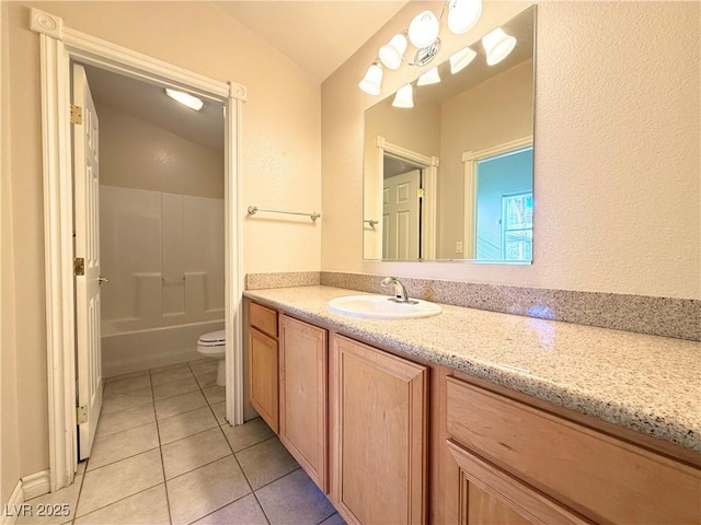 full bathroom with tub / shower combination, vanity, tile patterned flooring, toilet, and lofted ceiling