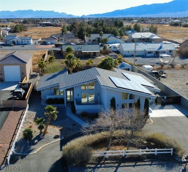 birds eye view of property with a mountain view