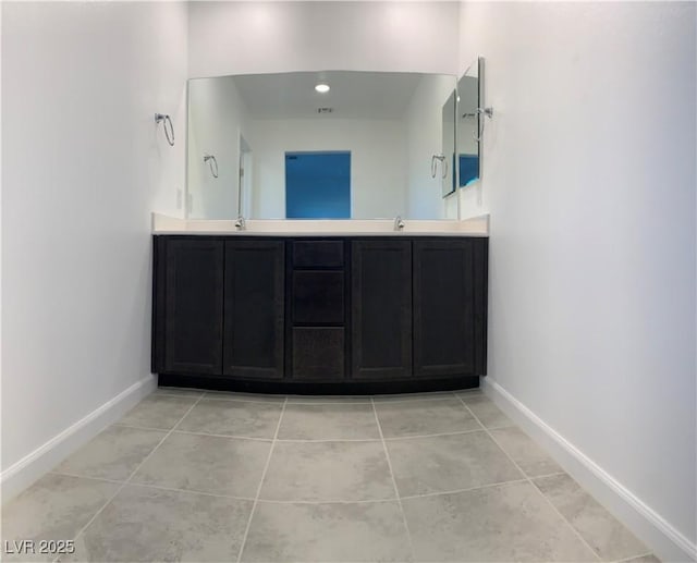 bathroom featuring tile patterned floors and vanity