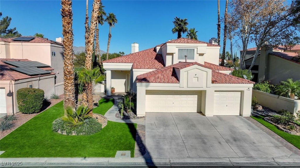 mediterranean / spanish-style house featuring a front lawn