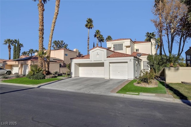 mediterranean / spanish-style house featuring a garage