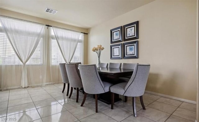 dining area with light tile patterned floors