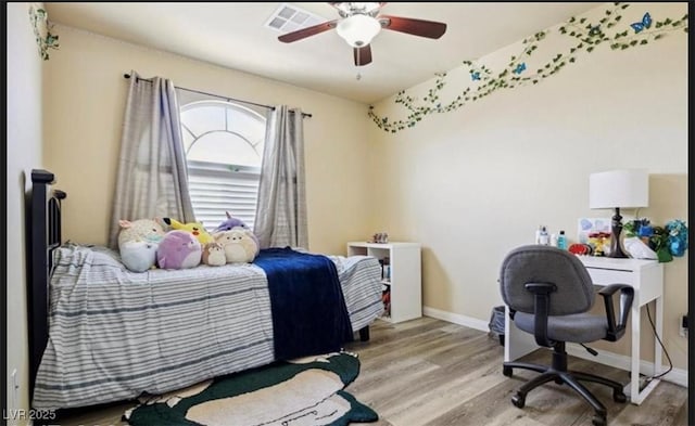 bedroom featuring ceiling fan and light hardwood / wood-style flooring